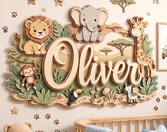 May include: A multi-layered wooden wall sign featuring the name Oliver in large script lettering. The design includes cutouts of a lion, elephant, giraffe, monkey, toucan, and zebra set against a savanna landscape with trees, stars, and animal paw prints.