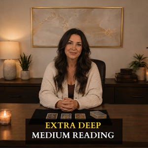 May include: A person with long dark hair wearing a cream-colored cardigan sits at a dark wooden desk with three tarot cards and a deck of cards. The text on the image reads EXTRA DEEP MEDIUM READING in yellow and white capital letters.