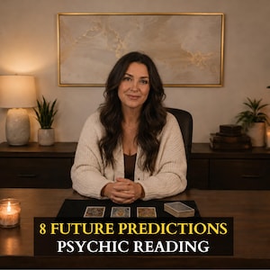 May include: A person with long dark hair wearing a cream-colored cardigan sits at a dark wooden desk with three tarot cards and a deck of cards. The text 8 FUTURE PREDICTIONS PSYCHIC READING is displayed at the bottom of the image.