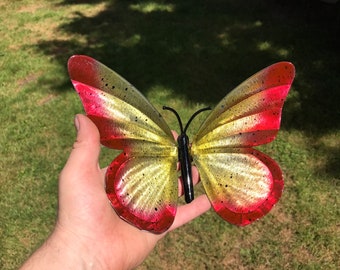 A yellow and red Metal Butterfly Sculpture