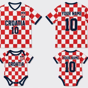 May include: A red and white checkered t-shirt and a matching baby bodysuit. The front features the text CROATIA and the number 10, while the back displays YOUR NAME and the number 10. Both garments have dark blue trim and a small crest on the chest.