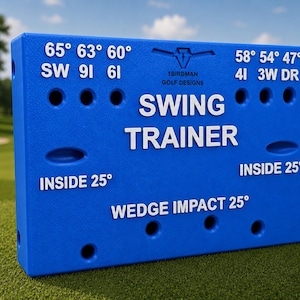 May include: A rectangular blue golf swing trainer device featuring white text and markings. The front displays the text 1BIRDMANGOLF DESIGNS, SWING TRAINER, INSIDE 25, and WEDGE IMPACT 25, along with various degree angles and club labels like 65, 63, 60, 58, 54, 47, SW, 9I, 6I, 4I, 3W, and DR.