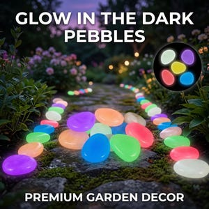 May include: Glow in the dark pebbles arranged along a garden path. The smooth, rounded stones emit vibrant colors including blue, green, orange, pink, and purple. The text GLOW IN THE DARK PEBBLES and PREMIUM GARDEN DECOR is visible in the image.