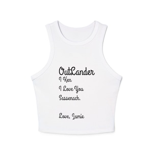 May include: White crop top with the text "Outlander, I Ken, I Love You, Sassenach. Love, Jamie" in black script. The top is sleeveless with a rounded neckline.