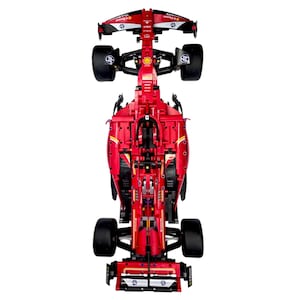 May include: A top-down view of a red Formula 1 race car model featuring black tires, a detailed cockpit, and various sponsor logos including HP and Shell. The vehicle displays a complex mechanical structure with visible red body panels and wings.