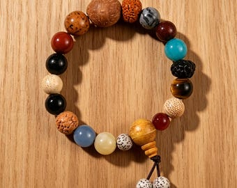 Vintage-style Bodhi seed rosary bracelet, made of natural stone and wood beads, a handcrafted oriental soothing meditation wrist accessory.