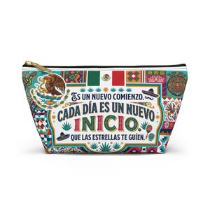 May include: A colorful zippered pouch with a Mexican-themed design. The pouch features the Mexican flag, an eagle emblem, and the text "Es un nuevo comienzo. Cada día es un nuevo inicio. Que las estrellas te guíen."