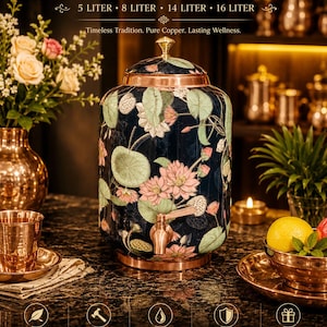 May include: A copper water pot with a dark blue exterior featuring a pink and green lotus flower pattern. The pot includes a copper lid with a knob, a copper spigot, and a copper base. Text on the pot reads COPPER WATER POT 5 LITER 8 LITER 14 LITER 16 LITER.