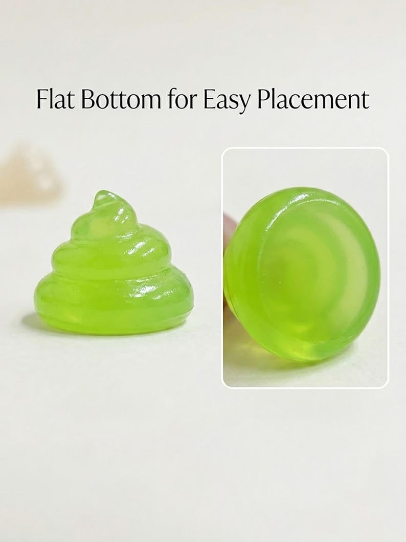 May include: A translucent lime green figurine shaped like a coiled swirl with a smooth, flat circular base. The text Flat Bottom for Easy Placement is visible above the object, which is shown from both a side profile and a bottom view.