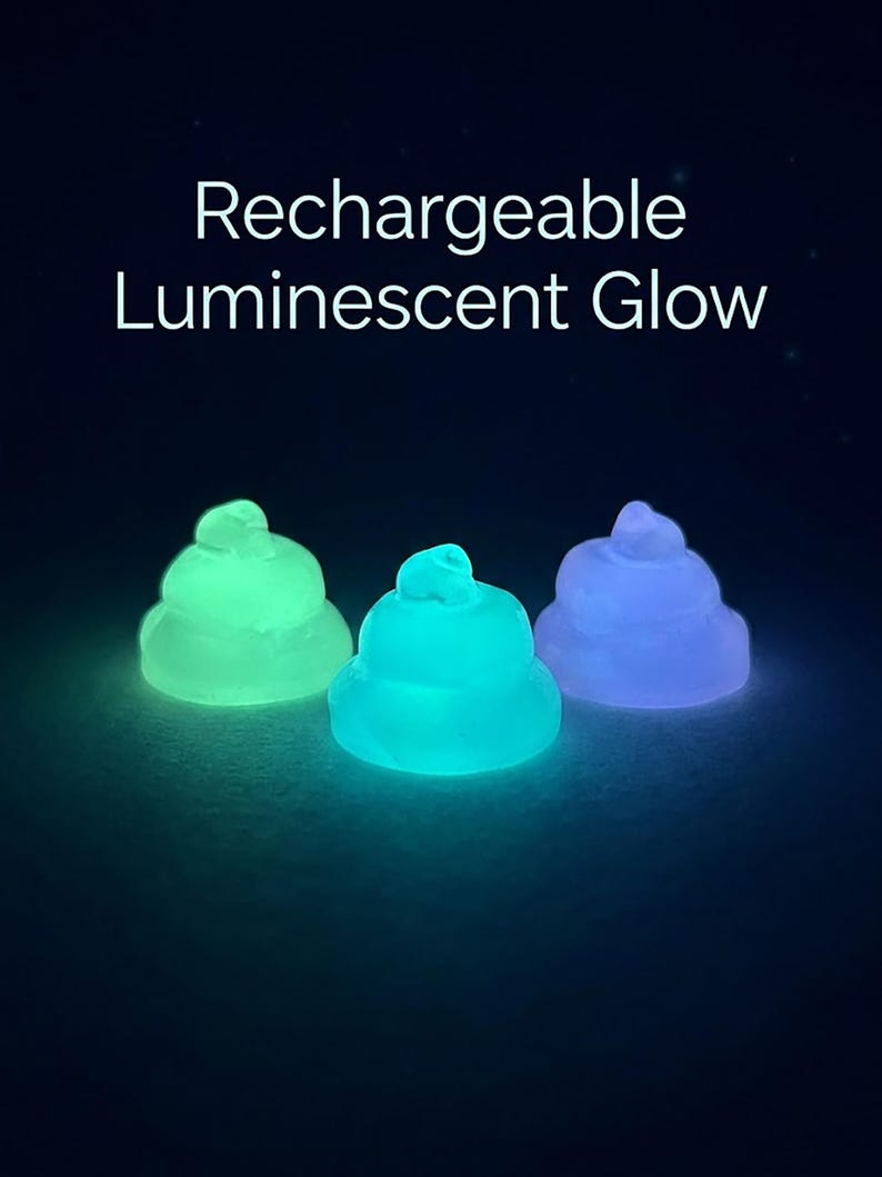 May include: Three small, rounded, pile-shaped objects that emit light in green, cyan, and purple. The text "Rechargeable Luminescent Glow" is displayed in white above the objects against a dark background. Each object has a smooth, translucent texture.