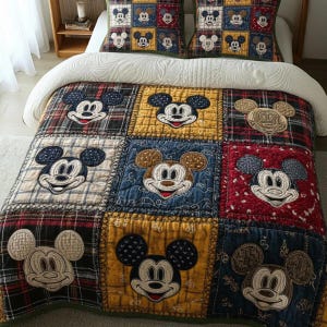 May include: A patchwork quilt and two matching pillowcases featuring Mickey Mouse. The quilt displays a grid of squares in various colours and plaid patterns, each with an embroidered Mickey Mouse face. The pillowcases have a repeating Mickey Mouse pattern.
