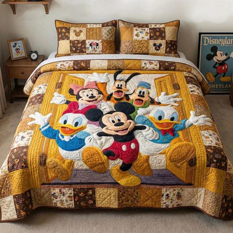 May include: A colourful quilt featuring Mickey Mouse, Minnie Mouse, Donald Duck, Goofy, and Pluto. The quilt has a yellow centre with the characters and a patchwork border in brown and tan. Two matching pillowcases are on the bed.