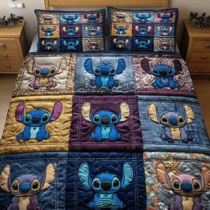 May include: A patchwork quilt and two pillowcases featuring the character Stitch from Lilo & Stitch. The quilt and pillowcases have a denim-like appearance with embroidered Stitch designs in various colours, including blue, purple, and gold.
