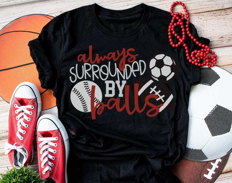 Sports Mom T-Shirt Always Surrounded by Balls 5050 CottonPoly Unisex T Shirt Soft and Comfy High Quality T Shirt Made in America