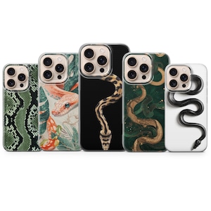 May include: Five smartphone cases arranged in a row, each featuring a unique snake-themed design. The patterns include green snakeskin, a snake among tropical leaves, a tan snake on black, a golden snake on dark green, and a black snake on white.