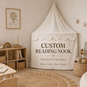 May include: A cream-colored fabric canopy with a scalloped edge, featuring the dark brown text CUSTOM READING NOOK, a heart icon, Made Just for Your Space, and Fabric • Color • Size • Details printed on the front panel of the hanging tent.