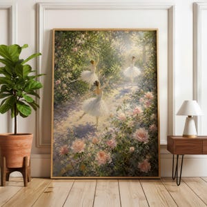 May include: A framed rectangular wall art print depicting three figures in white tutus dancing in a sunlit garden filled with pink roses and lush green foliage. The painting features soft light filtering through trees, creating a serene atmosphere.