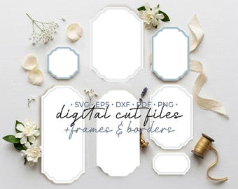 May include: A collection of white labels and frames with light blue borders in various shapes and sizes, featuring the text SVG, EPS, DXF, PDF, PNG, digital cut files, and frames & borders arranged on a white surface with floral accents.