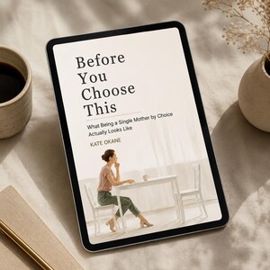 May include: A digital tablet displays the book cover of "Before You Choose This" by Kate Okane. The cover features a woman seated at a table. A cup of coffee and a small vase are visible.