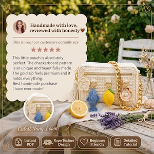 May include: A cream-colored, handmade crochet pouch with a gold chain strap and zipper. The pouch features a checkerboard pattern and is adorned with a flower, tassel, and small crochet charms, including a fish, lemon, and seashell. A half-cut lemon and lavender sprigs are also present.