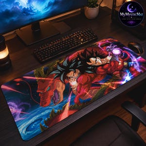 May include: A rectangular desk mat featuring a vibrant, full-colour graphic illustration of a spiky-haired character in a red outfit alongside a large red dragon. The design includes swirling purple and blue energy effects against a dark background.