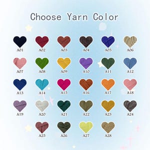 May include: A color chart titled Choose Yarn Color featuring twenty-eight heart-shaped swatches of yarn in various shades. Each heart is labeled with a code from A01 to A28, displaying colors including black, red, brown, blue, green, yellow, and pink.