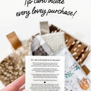 a person holding up a card with the words tips card inside every lovey purchase