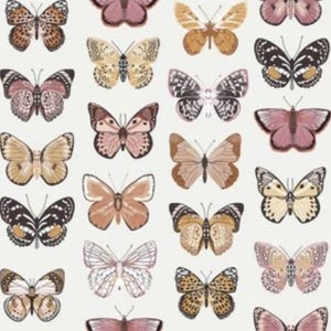 May include: A pattern of various butterflies in shades of brown, pink, and cream against a white background. The butterflies have detailed wing patterns and are arranged in a grid-like fashion, creating a decorative design.