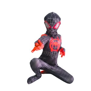May include: A black and red Spider-Man costume with a web pattern. The costume features a mask with white eyes and a red spider emblem on the chest. The hands and parts of the costume are red.