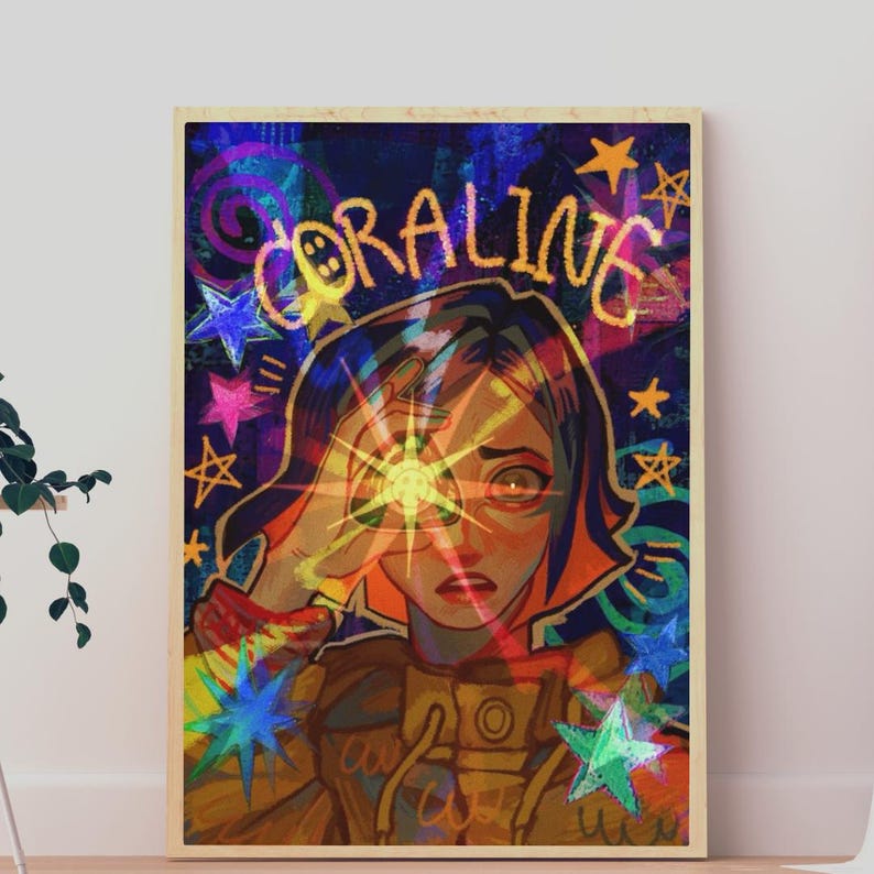 May include: A rectangular wall art print featuring a stylized illustration of a character with short hair holding a glowing object to one eye. The word Coraline is written in yellow script at the top, surrounded by colorful stars and swirls.