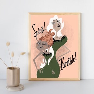 May include: A framed art print featuring two stylized female figures in green dresses against a peach background. The figure on the left has reddish-brown hair and the text Spink! above, while the figure on the right has white hair and the text Forcible! below.