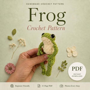 May include: A handmade crochet pattern for a small green frog with a cream-colored belly. The digital document features the text 'HANDMADE CROCHET PATTERN Frog Crochet Pattern', 'PDF INSTANT DOWNLOAD', 'Beginner Friendly', '11-Page PDF', and 'Photos Every Step'.