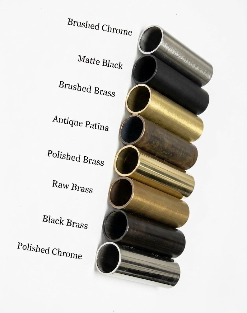 May include: A vertical arrangement of eight cylindrical metal tubes in various finishes, labeled as Brushed Chrome, Matte Black, Brushed Brass, Antique Patina, Polished Brass, Raw Brass, Black Brass, and Polished Chrome, showcasing distinct textures.