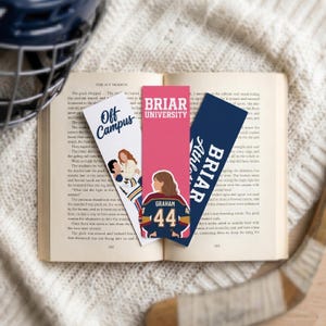 May include: Three rectangular bookmarks featuring hockey themes. One white bookmark reads Off Campus with an illustration of two people. A pink bookmark reads Briar University with a person wearing a jersey numbered 44. A navy bookmark reads Briar Athletics.