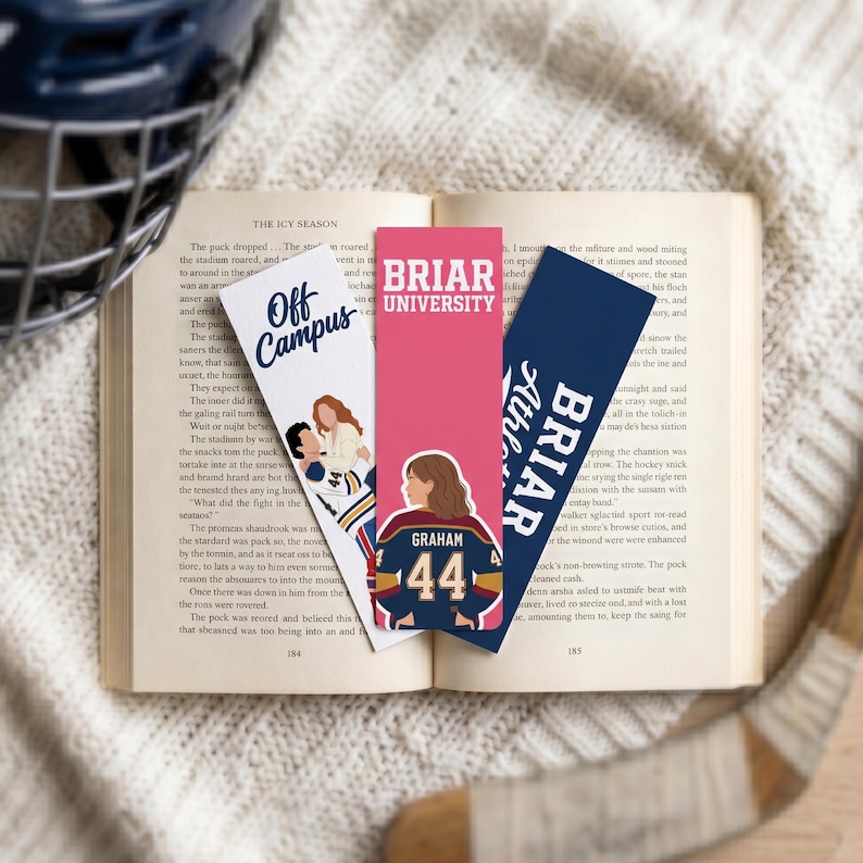 May include: Three rectangular bookmarks featuring hockey themes. One white bookmark reads Off Campus with an illustration of two people. A pink bookmark reads Briar University with a person wearing a jersey numbered 44. A navy bookmark reads Briar Athletics.