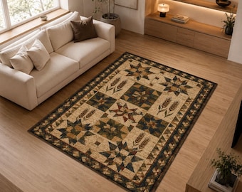 May include: A rectangular area rug featuring a patchwork quilt design with alternating blocks of star patterns and wheat stalks in shades of tan, brown, dark green, and navy blue, finished with a geometric border in matching earth tones.
