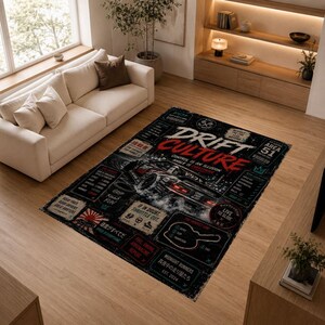 May include: Black rectangular area rug with a graphic design featuring a drifting car, the words "DRIFT CULTURE", and other text elements. The rug has a distressed, vintage aesthetic and is placed on a wooden floor.