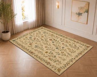 May include: A rectangular area rug featuring a cream-colored base with a repeating pattern of delicate floral vines in shades of muted red, blue, and green. The design includes a decorative border with similar botanical motifs throughout.
