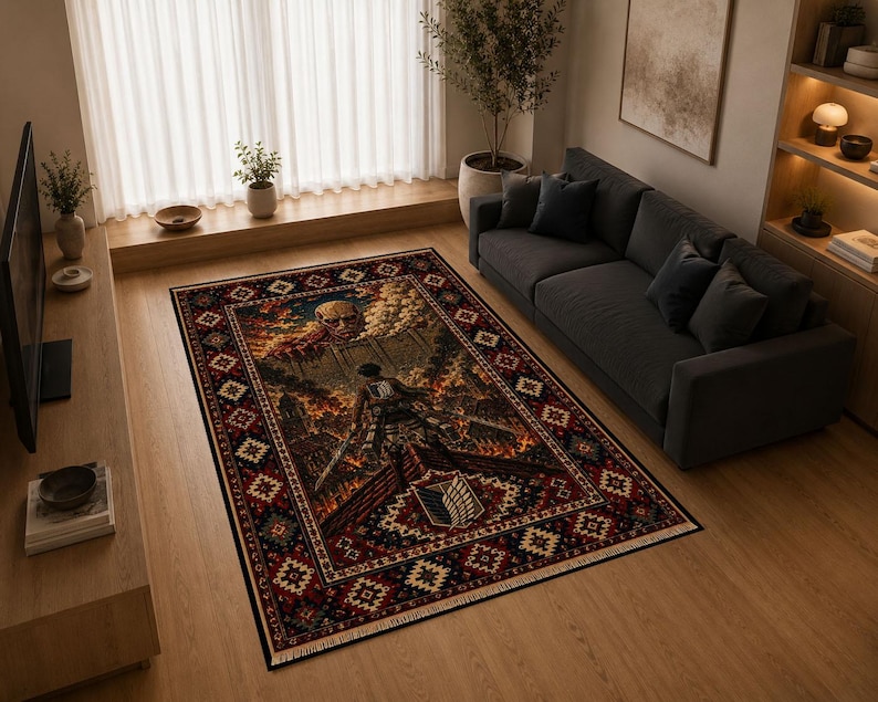 May include: A rectangular area rug featuring a detailed graphic illustration of a giant humanoid figure peering over a stone wall, with a soldier in the foreground. The rug has a dark red, black, and gold ornate border with geometric patterns.