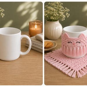 May include: A white ceramic mug featuring a removable light pink crocheted cat cozy with fringe detailing, paired with a matching square crocheted coaster with fringe edges. The cat face design includes embroidered eyes, a nose, and whiskers.