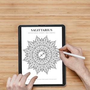 May include: A digital tablet displaying a black and white Sagittarius mandala coloring page. The screen features the text SAGITTARIUS, ADVENTUROUS, HONEST, FREE-SPIRITED, and a central arrow symbol. A white stylus is held near the screen.