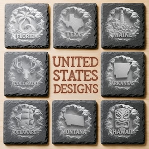 May include: A set of eight square dark gray slate coasters featuring carved relief designs of U.S. states including Florida, Texas, Maine, Colorado, Arkansas, Delaware, Montana, and Hawaii, with the text UNITED STATES DESIGNS in the center.