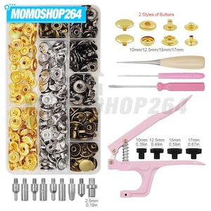 May include: A sewing kit featuring a clear plastic organizer box filled with gold, silver, bronze, and black metal snap buttons. Includes a pink hand press tool, two awls, a screwdriver, and various metal dies labeled 10mm to 17mm.