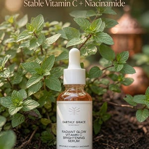 May include: A clear glass dropper bottle of Earthly Grace Radiant Glow Vitamin C Brightening Serum with 30 ml capacity. The label features the text Radiant Glow Vitamin C Brightening Serum, Stable Vitamin C + Niacinamide, and 30 ml.