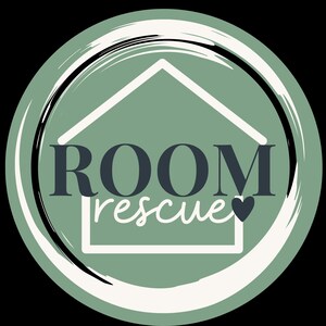 May include: A circular logo featuring a sage green background with a white brushstroke border. Centered is a white outline of a house shape. The text ROOM is in dark grey capital letters, with the word rescue in white script below it.
