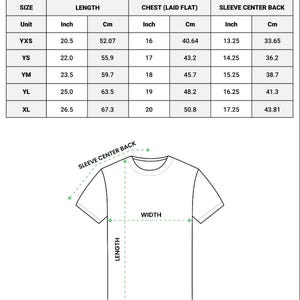 May include: A white youth t-shirt size chart with measurements in inches and centimeters. The chart includes sizes YXS, YS, YM, YL, and XL, detailing length, chest, and sleeve center back measurements. A diagram illustrates the measurement points on a t-shirt.