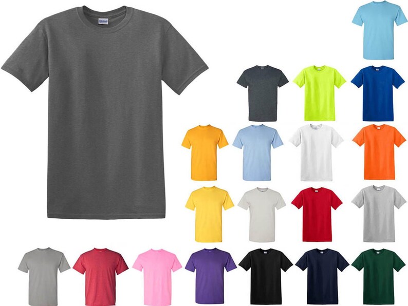 May include: A charcoal gray short-sleeve t-shirt is displayed prominently, with a variety of other solid-color t-shirts arranged around it. The shirts are in various colors, including yellow, blue, red, and green.