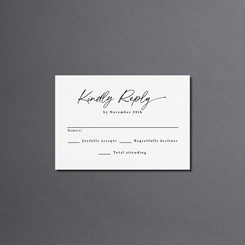 May include: A white RSVP card with black text that reads "Kindly Reply by November 29th". The card has lines for the guest's name, a check box for "Joyfully accepts", a check box for "Regretfully declines", and a line for the total number of people attending.