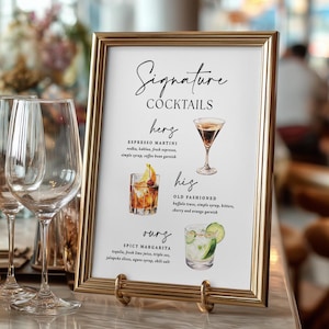 May include: A gold-framed sign with the words "Signature Cocktails" in elegant script. The sign displays illustrations and descriptions of three cocktails: Espresso Martini, Old Fashioned, and Spicy Margarita.