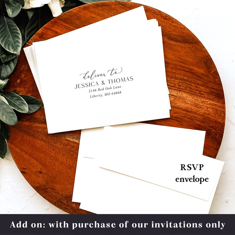 May include: A stack of white envelopes with a black RSVP envelope on top. The top envelope has a black and white address label that reads "deliver to Jessica & Thomas 2146 Red Oak Lane Liberty, MO 64068".